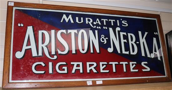 A framed reverse glass advertising sign for Murattis Ariston + Neb-Ka Cigarettes